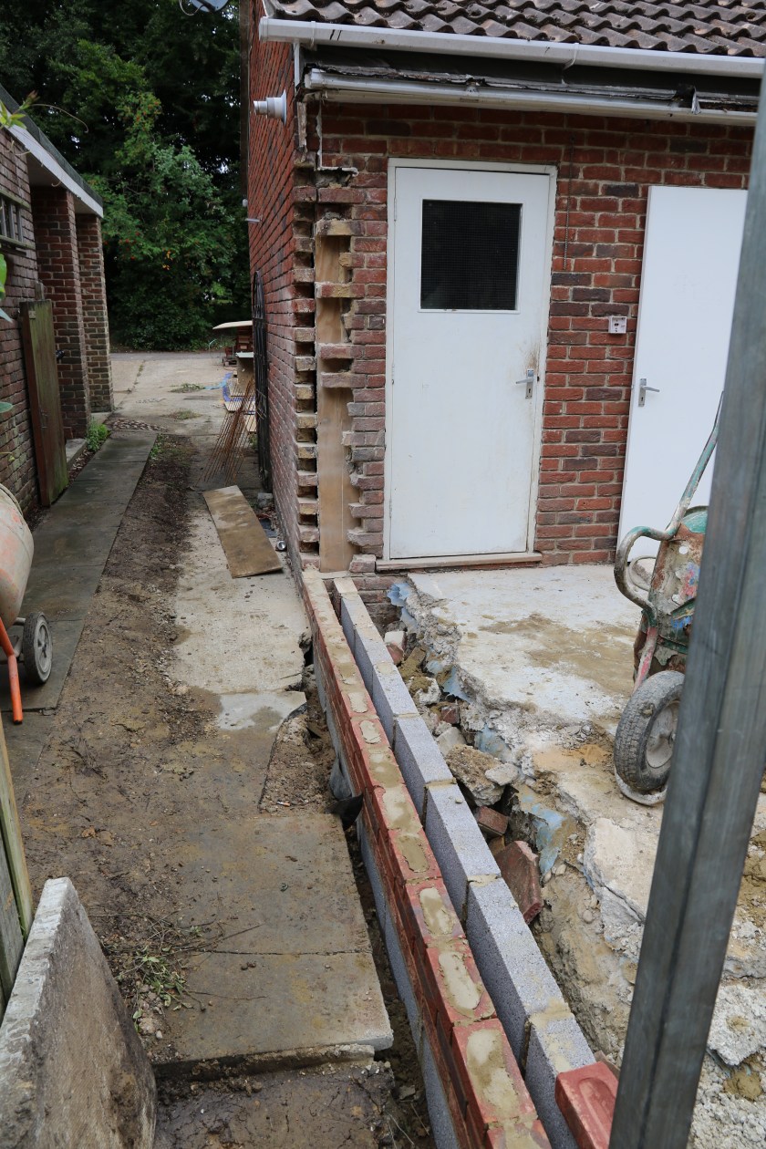 Conservatory - The beginnings of the end wall. The garage side wall has been prepared for the building of a support pillar.