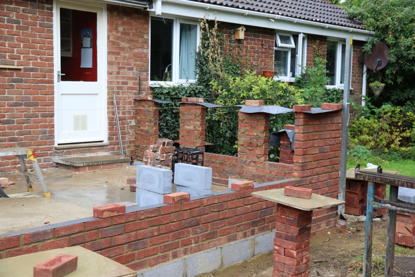 Conservatory - view showing the window pillars starting to grow. You can also see that the wall repair has been completed.