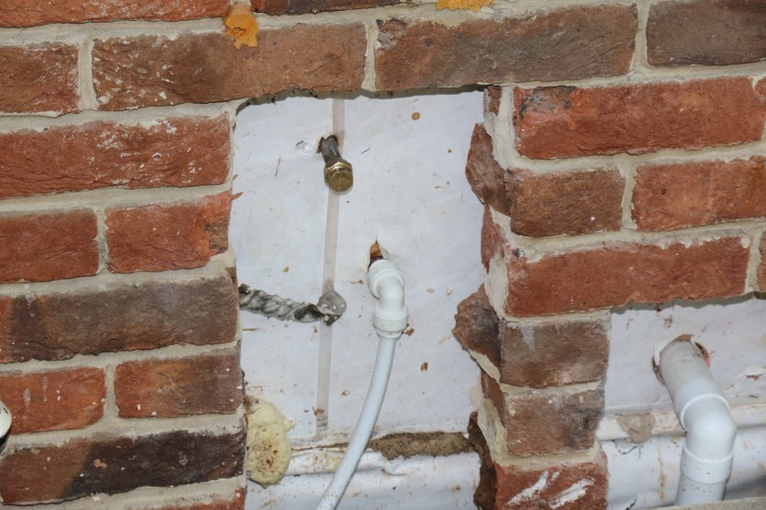 Conservatory - Old, redundant hot water supply pipe is capped. New cold water supply line is connected.