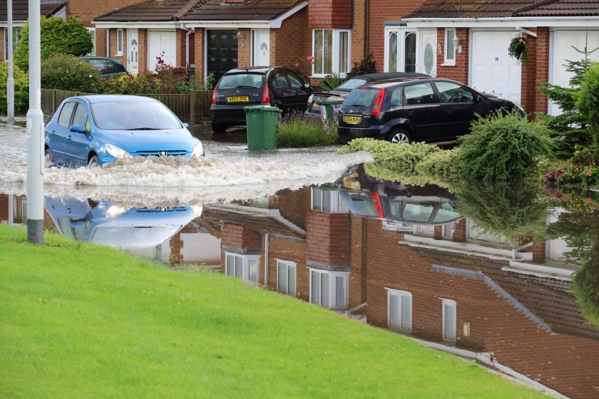 Moreton Floods - Millhouse Lane, even travelling at relatively slow speeds pushes a tidal wave into the gardens