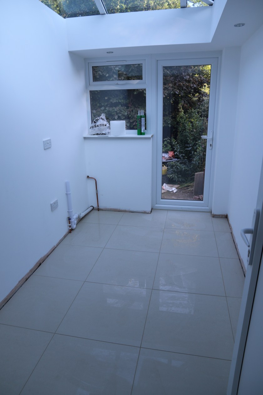 Conservatory - Utility room tiling has been laid and grouted
